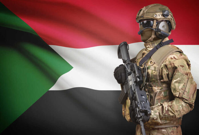 Soldier,In,Helmet,Holding,Machine,Gun,With,National,Flag,On