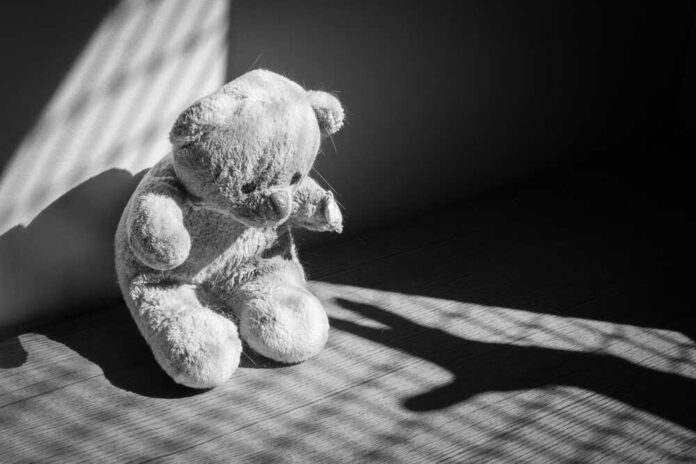 Damaged,And,Dirty,Teddy,Bear,Under,Casted,Shadow,,Representing,A