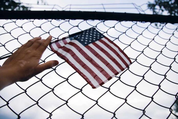 Close,Up,Of,A,American,Flag,In,Hand,Attached,To
