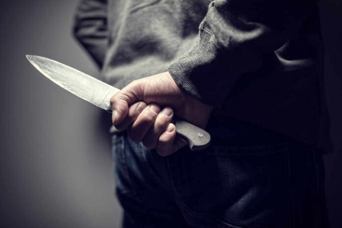 Criminal,With,Knife,Weapon,Hidden,Behind,His,Back