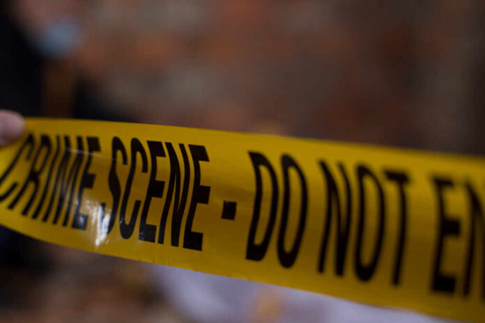 Police,Line,Do,No,Cross,With,Gas,Station,Background,In
