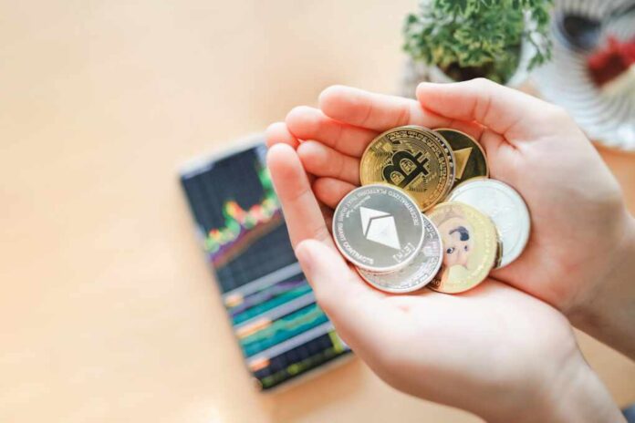 Maesot,,Thailand-,June,13,,2021:hand,Of,Woman's,Holding,Cryptocurrency,Coin