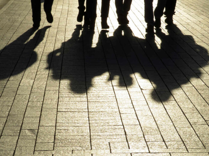 Silhouettes,And,Shadows,Of,People,On,The,Street.,Crowd,Walking