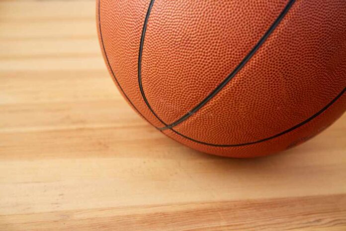 A,Basketball,Ball,Close-up,On,A,Wooden,Floor