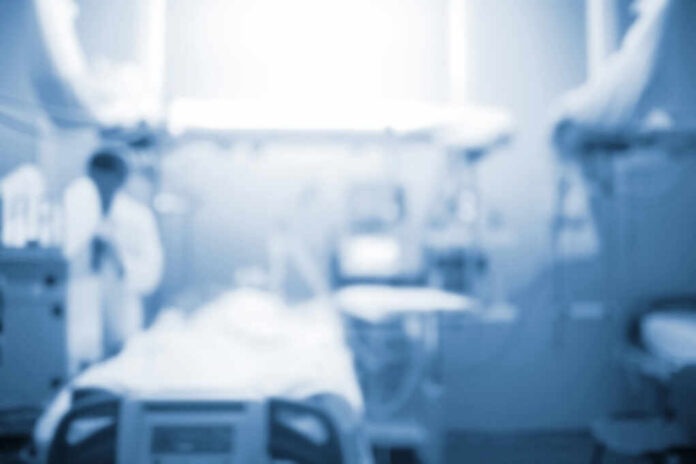 Blurred image of a medical professional in a hospital setting