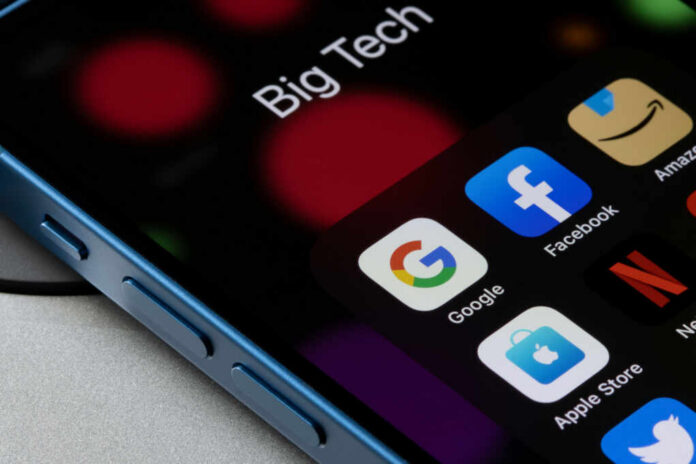 Close-up of a smartphone screen displaying various app icons including Google, Facebook, and Netflix