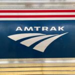 Close-up of the Amtrak logo on a train car