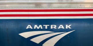 Close-up of the Amtrak logo on a train car