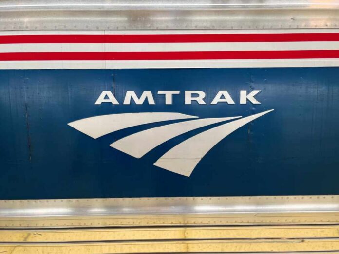 Close-up of the Amtrak logo on a train car