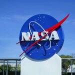 NASA logo displayed against a clear blue sky