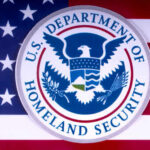 Mullin’s DHS Takeover: Will Chaos Reign? U.S. Department of Homeland Security emblem on a background of the American flag