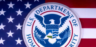 U.S. Department of Homeland Security emblem on a background of the American flag