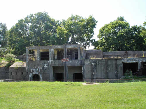 An abandoned military structure surrounded by greenery