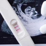Biden’s Reckless Abortion Policy Faces Massive Reversal Pregnancy test next to an ultrasound image and two white tablets