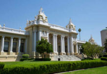 Exterior view of a historic courthouse with columns and decorative architecture