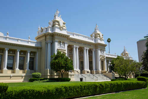 Exterior view of a historic courthouse with columns and decorative architecture