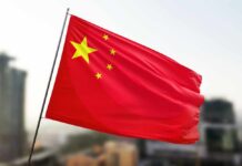 Waving flag of China with a star and four smaller stars