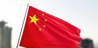 Waving flag of China with a star and four smaller stars