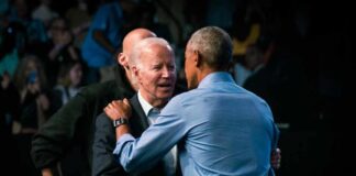 Two political leaders embracing at a public event
