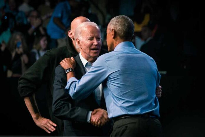 Two political leaders embracing at a public event