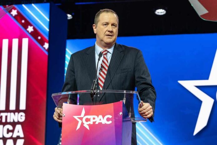 shutterstock_2269916591.jpg Speaker at a podium during a political conference