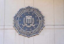 FBI seal mounted on a wall, representing the Federal Bureau of Investigation