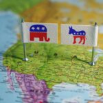 Democrats Reject Own Party—Poll Shock! Flags representing the Republican and Democratic parties on a map of the USA