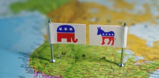 Flags representing the Republican and Democratic parties on a map of the USA