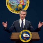 California governor delivering a speech at a podium