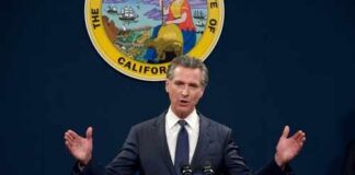 California governor delivering a speech at a podium