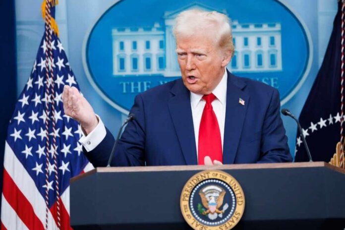 A government official speaking at a podium during a press conference