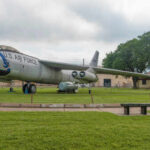 Unseen Drone Swarm TERRORIZES U.S. Nuclear Heartland A retired U.S. Air Force aircraft displayed outdoors on a grassy area