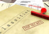 A collection of classified documents with a red 'Top Secret' stamp