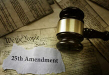 A gavel resting on a document labeled '25th Amendment' surrounded by historical papers