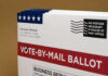 Vote-by-mail ballot with election details and postage information