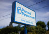 Sign for Planned Parenthood displaying the organizations name and website