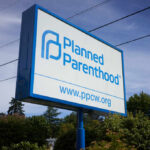 Sign for Planned Parenthood displaying the organizations name and website