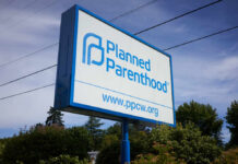Sign for Planned Parenthood displaying the organizations name and website