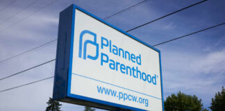 STUNNING Shift: Prenatal Care DOWN, Abortions UP Sign for Planned Parenthood displaying the organizations name and website
