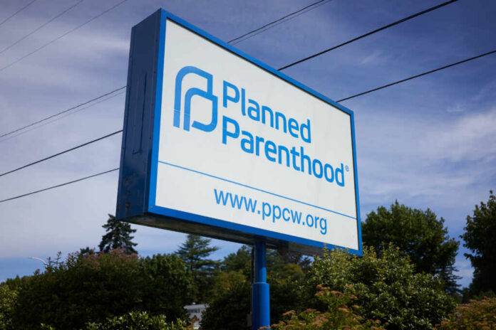 Sign for Planned Parenthood displaying the organizations name and website