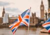 British flags in the foreground with the Houses of Parliament and Big Ben in the background
