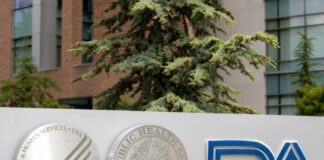 Signage featuring the FDA logo and symbols of health services