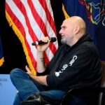 Speaker at a political event discussing issues with an audience
