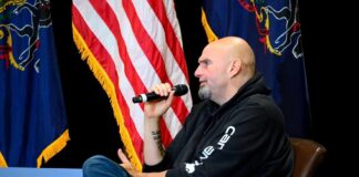 Speaker at a political event discussing issues with an audience