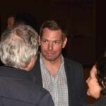 Group of people engaged in conversation at an event