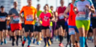 Blind Runner SHOCKS World With AI Marathon Feat A group of runners participating in a marathon on a sunny day