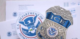 ICE badge and U.S. Department of Homeland Security emblem on official documents