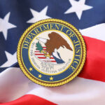 Department of Justice seal on an American flag background