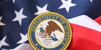 Department of Justice seal on an American flag background