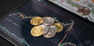 Various cryptocurrency coins on a digital trading chart